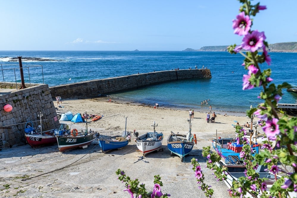 A group of boats on a beach.