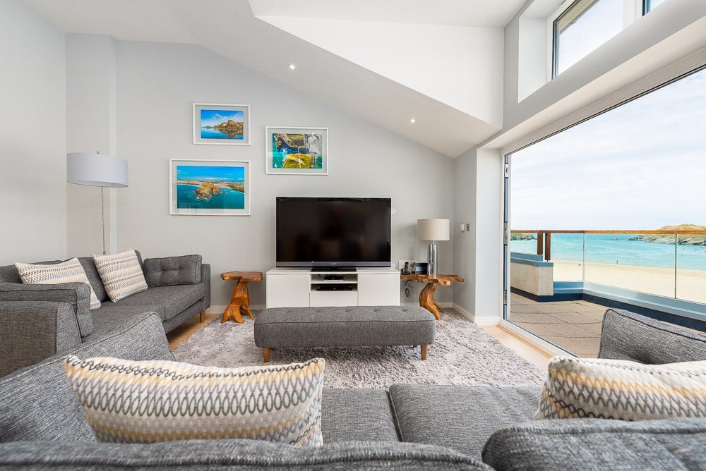A living room with a large glass door.