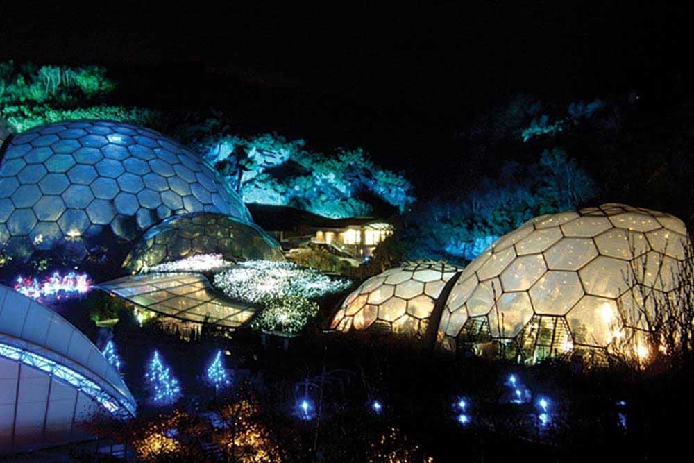 A group of geodesic domes at night. 