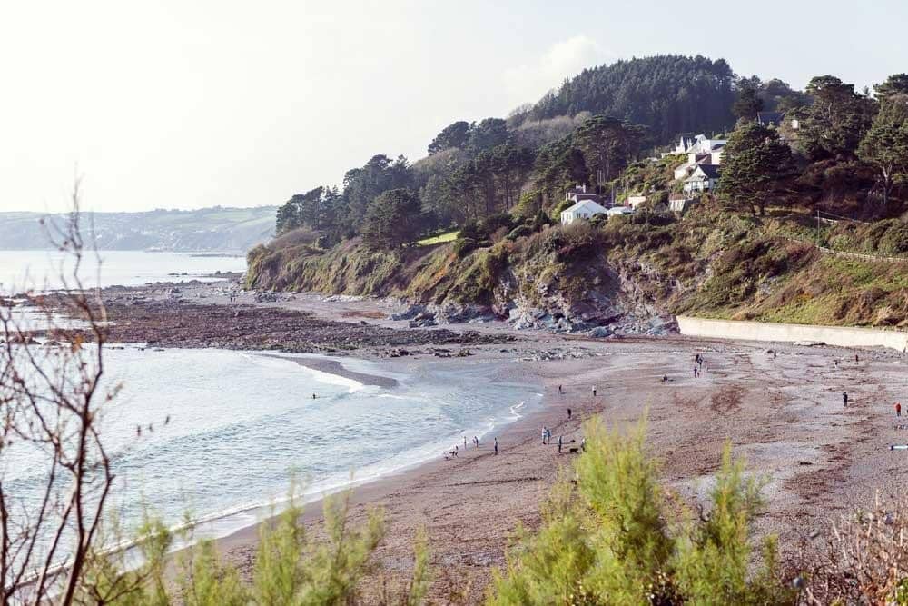 Houses on a cliff overlooking the sea.