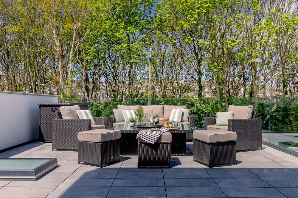 A patio with a table and chairs.