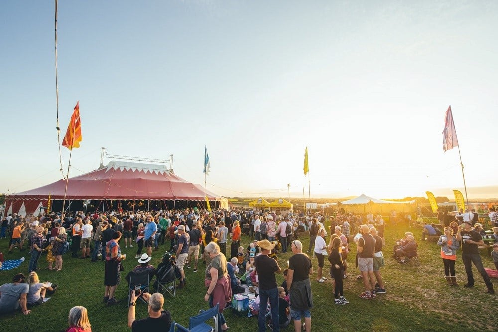 A large crowd of people in a field.
