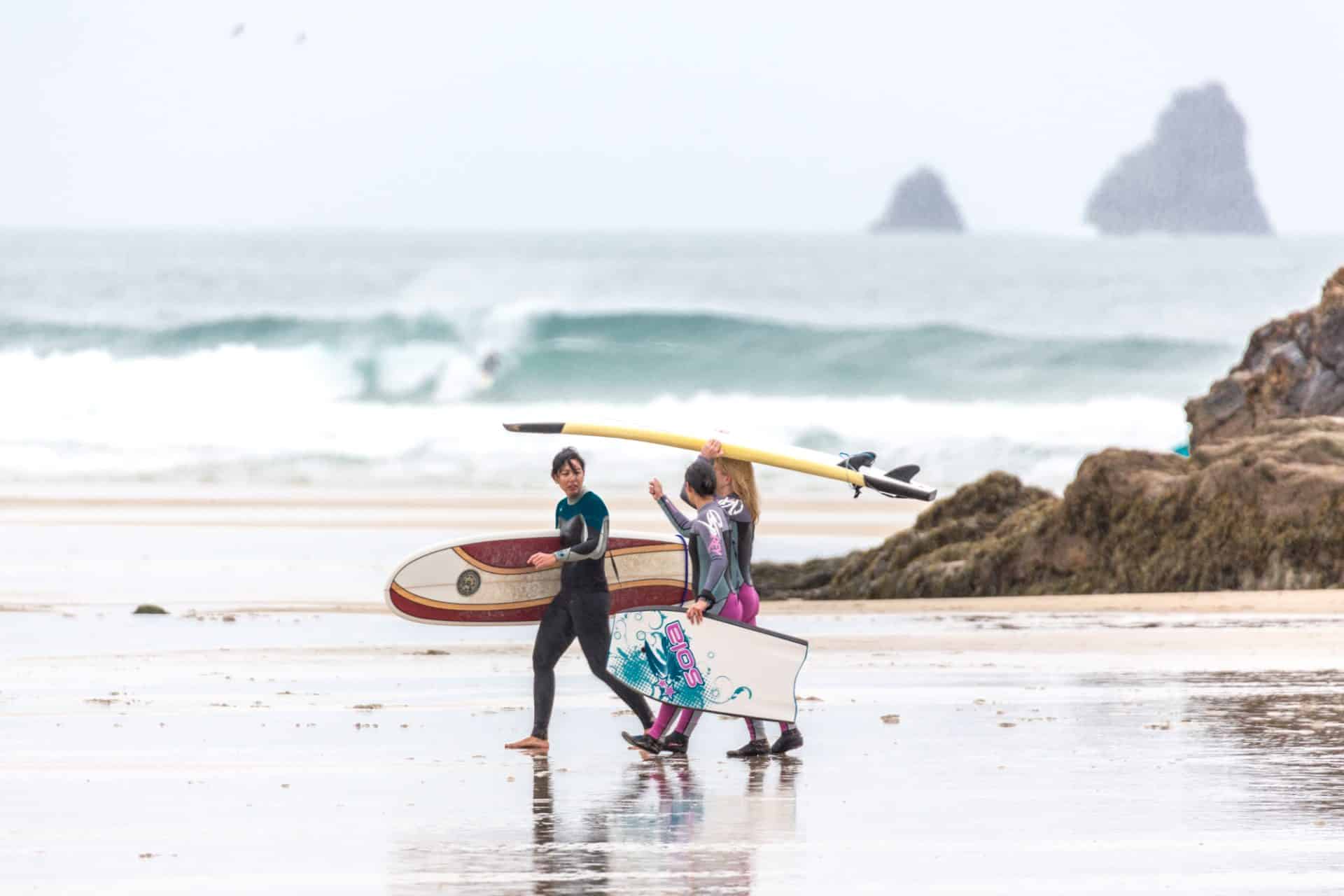 Surfers at Perranporth beach, Cornwall