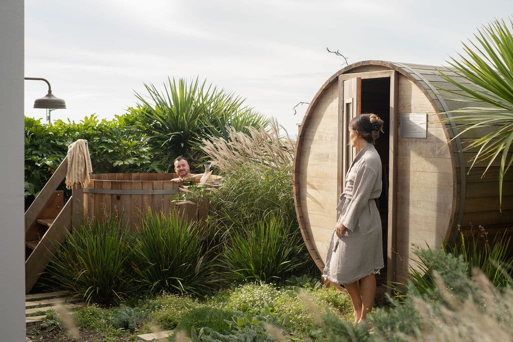 A couple in a sauna and hot tub