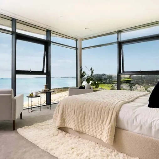 Modern bedroom with a panoramic view of the sea.