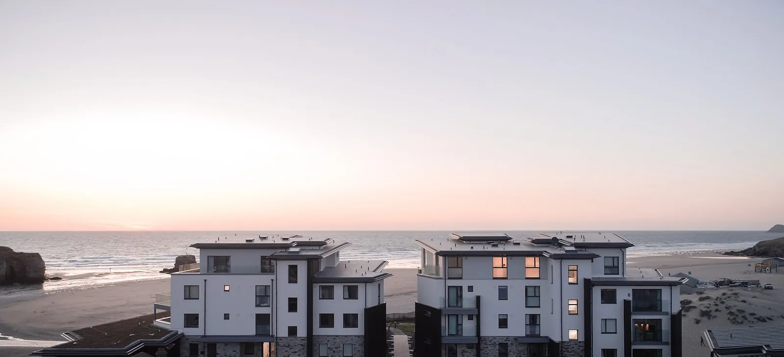 Modern apartment buildings overlooking the sea.