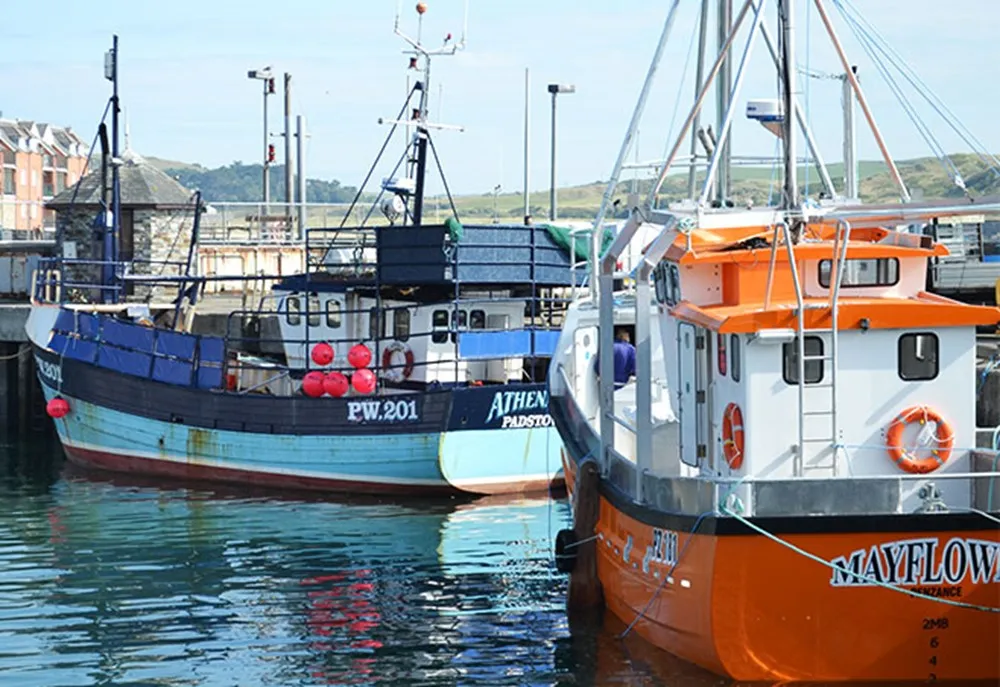 Boats floating in a harbour.