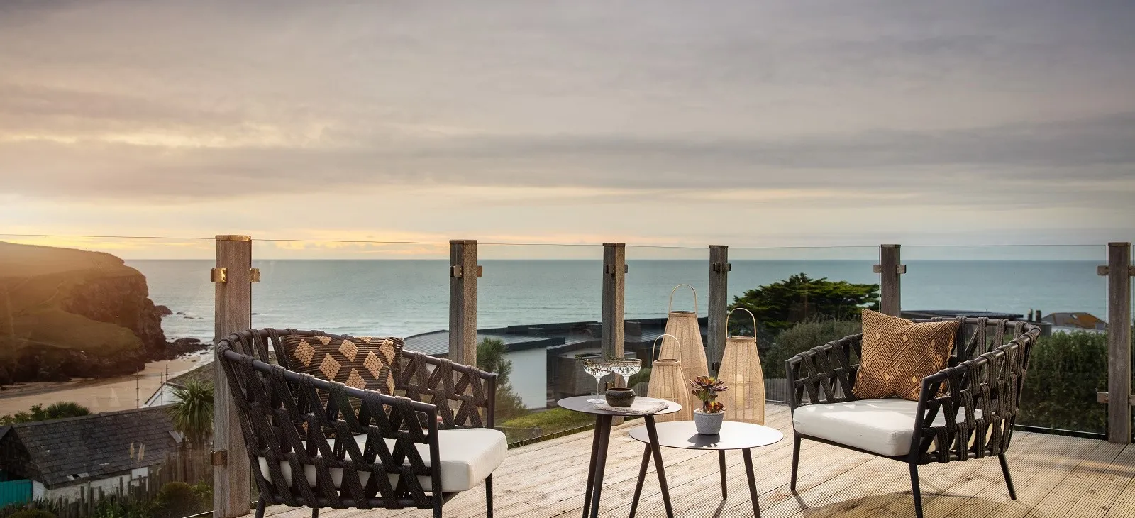 Balcony seating area overlooking the sea.