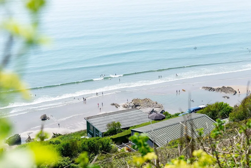 A beach with people on it.