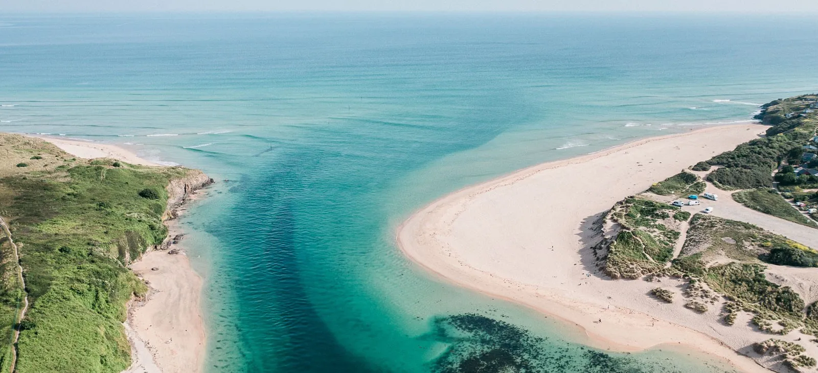 An estuary with beaches on either side.