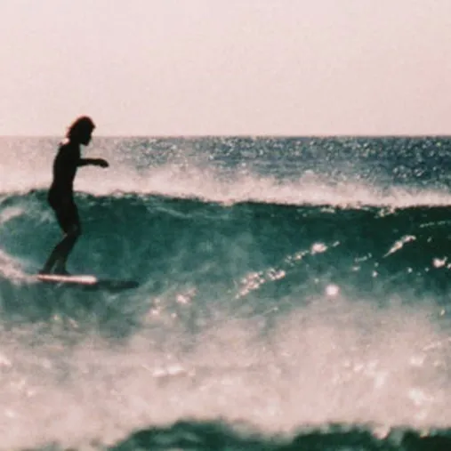 A person surfing on a wave.