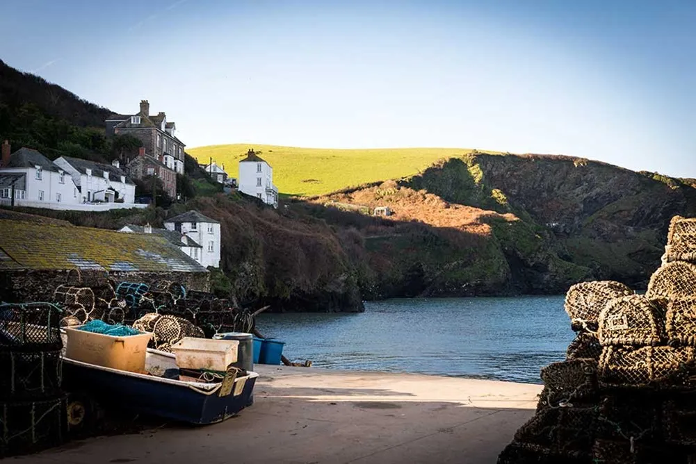 Lobster pots stacked against sea walls.