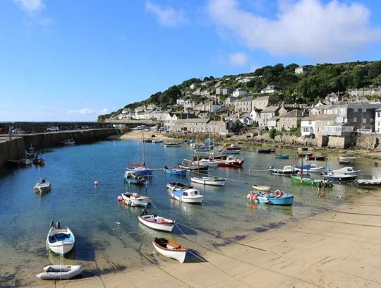 Boats moored at Mousehole harbour.