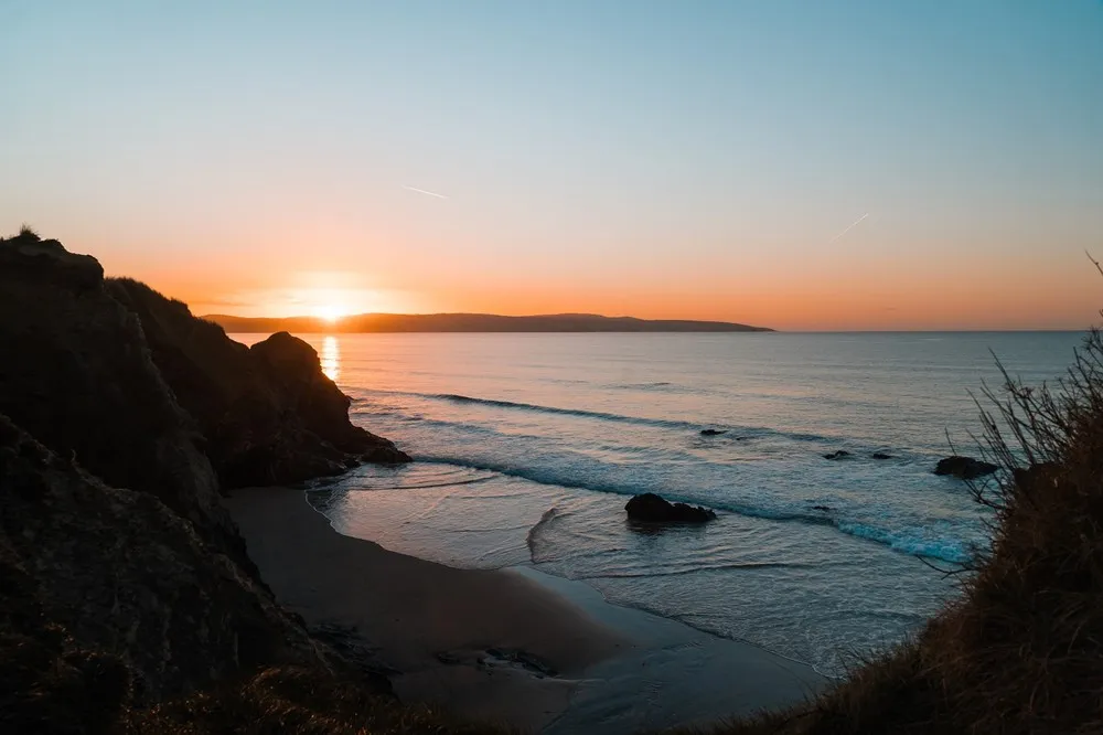 A sunset over a beach. 