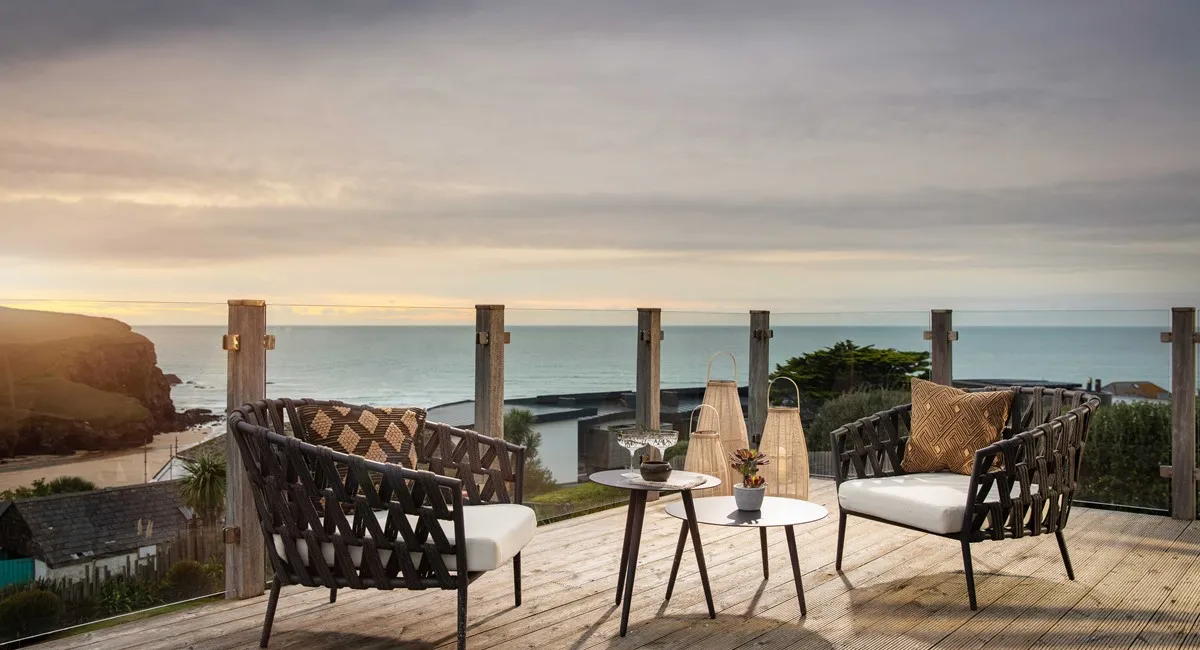 Balcony seating area overlooking the sea.