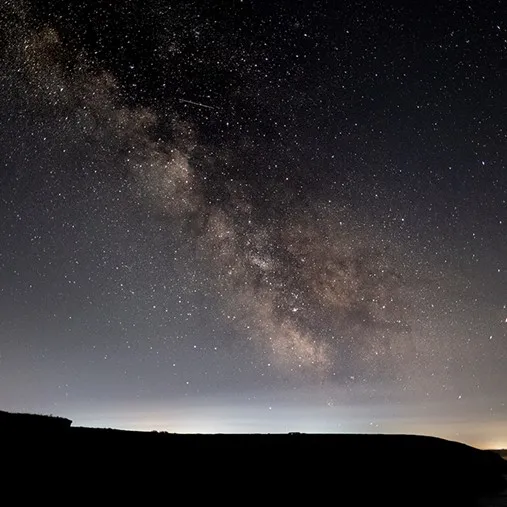 A starry sky over a hills.