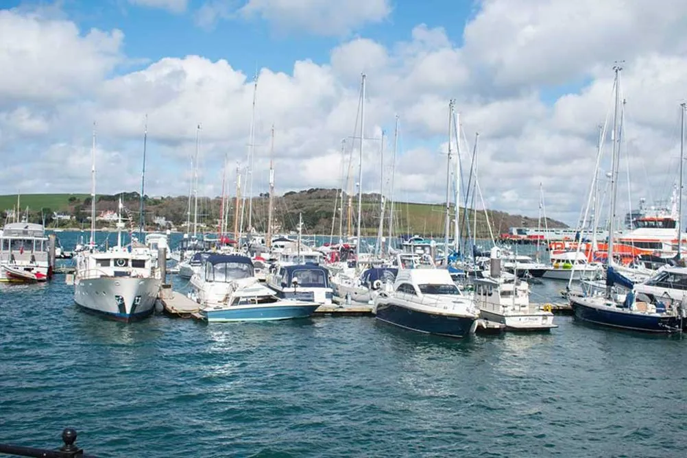 A group of boats in a harbor. 