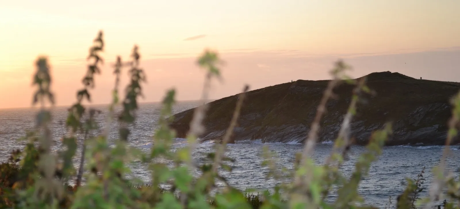 A view of rocky cliffs at dusk.