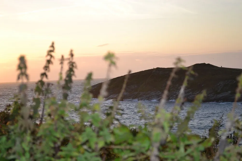 A rocky hill overlooking the sea.