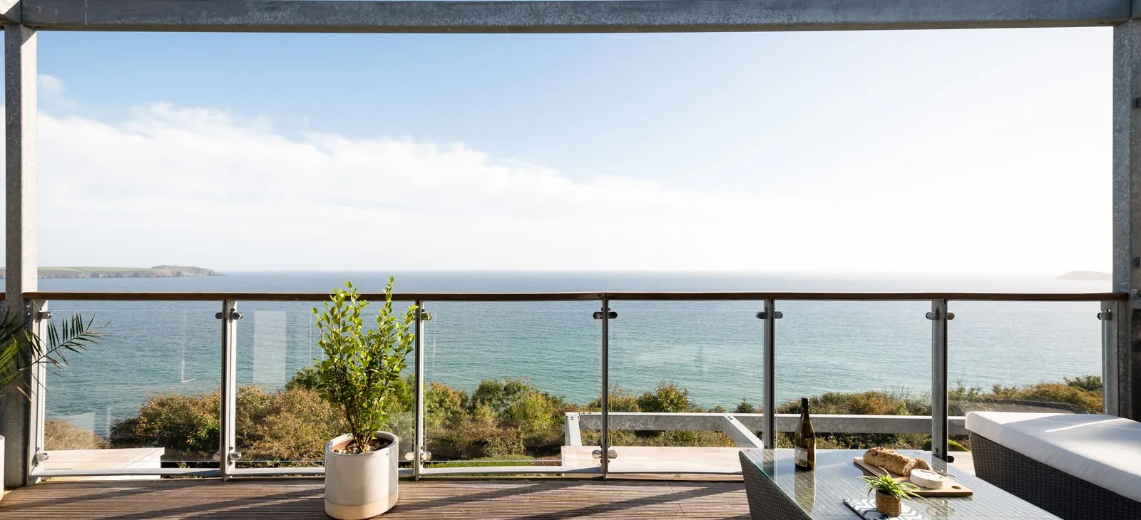 A balcony overlooking the ocean.