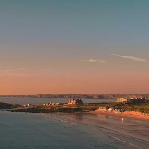 A beach at sunset.