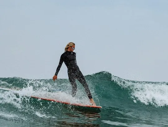 A person surfing on a wave.