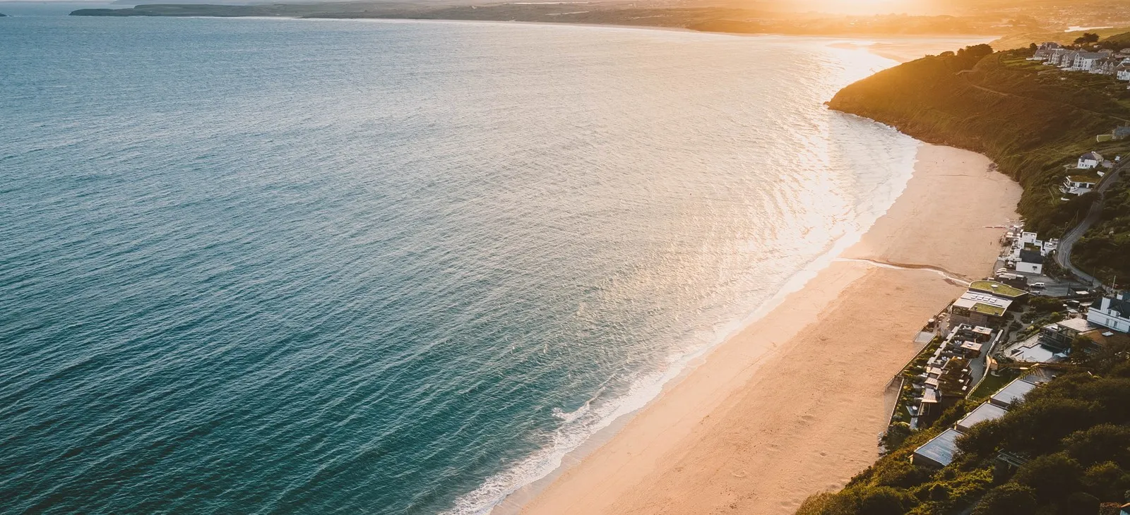 Sun setting over an empty beach.