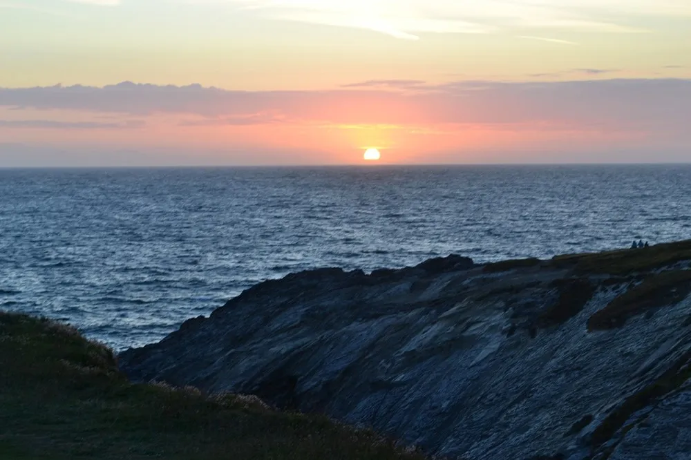 Beach cliffs overlooking the sunset.