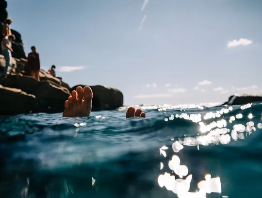 Feet in the water.