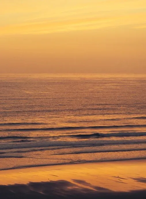 A sunset over a beach.