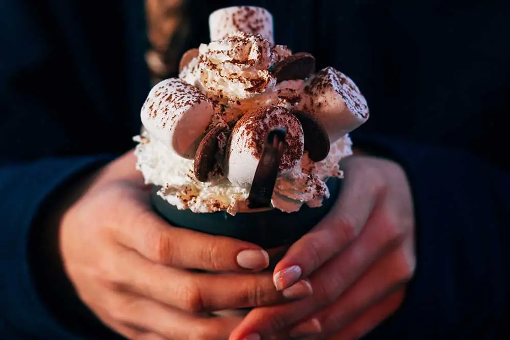 hot chocolate held in hands