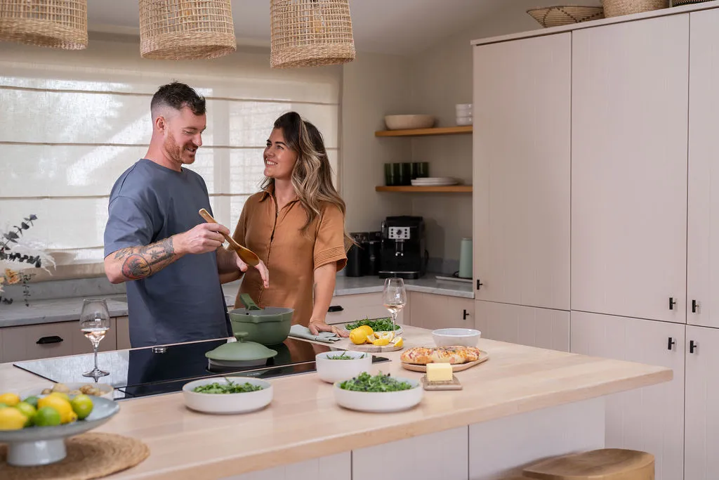 Couple in a kitchen cooking