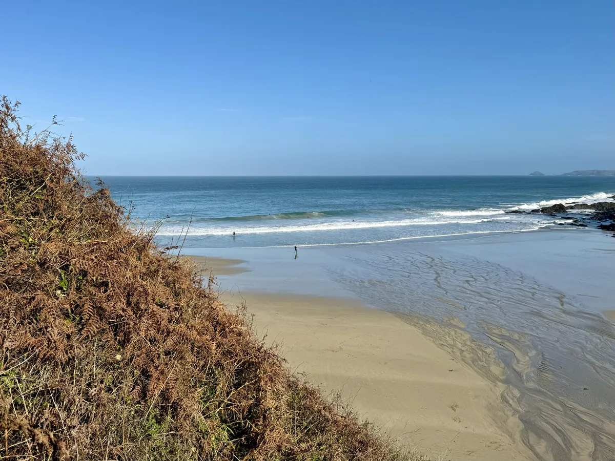A beach with blue skies
